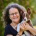 Susan Garrett holding Prophet as a puppy